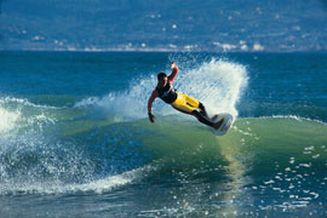 Surfista en Jeffreys Bay, Sudáfrica